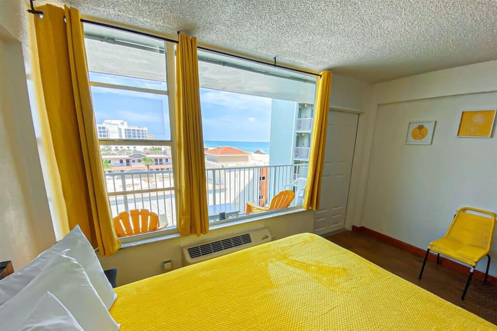 Freshly cleaned bedroom with ocean view in a Daytona Beach vacation rental