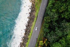 Aerial view of car on coastal road