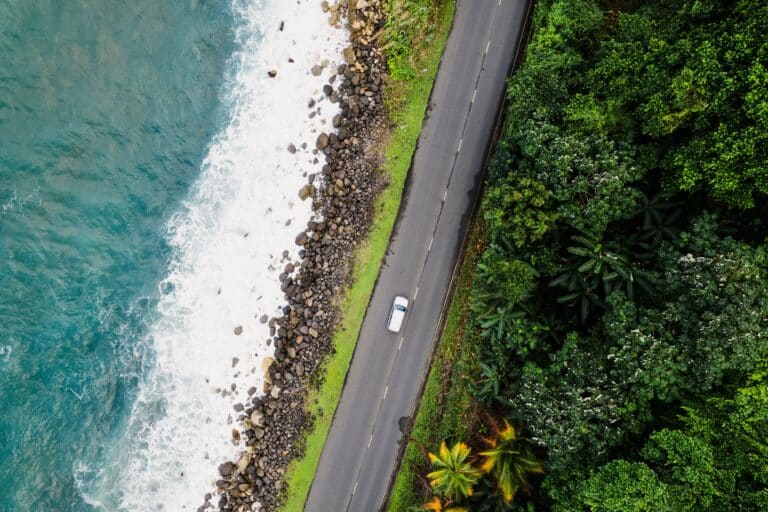 Aerial view of car on coastal road