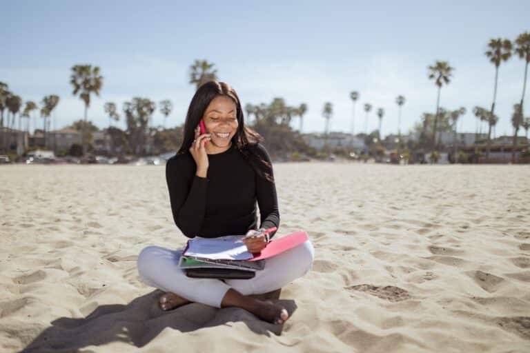 Woman on the phone at the beach