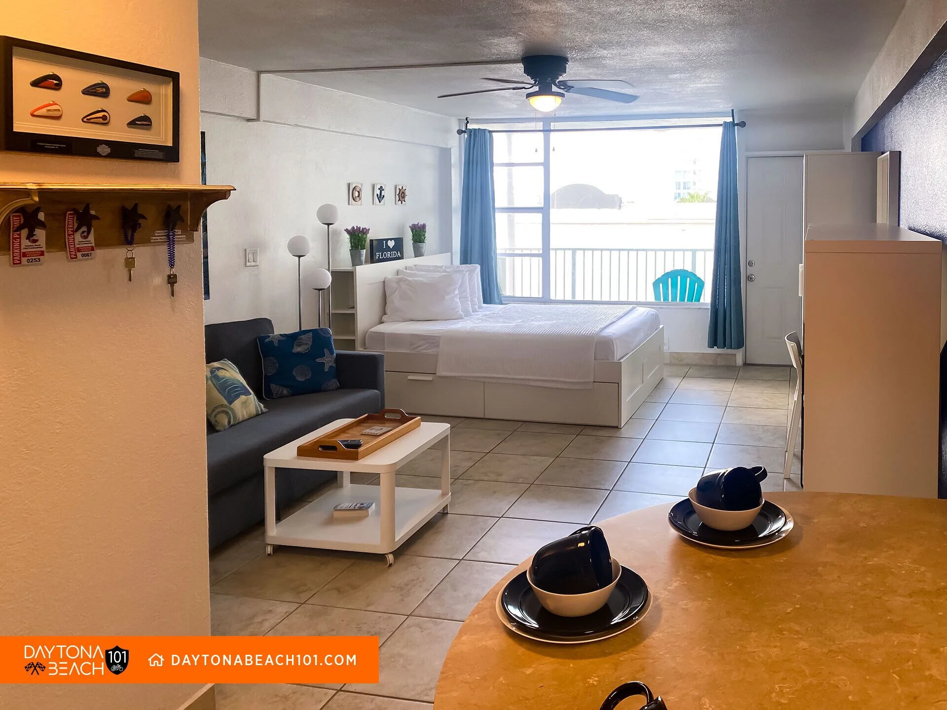 Modern studio apartment bedroom with king bed and ocean view balcony in Davenport, Florida rental