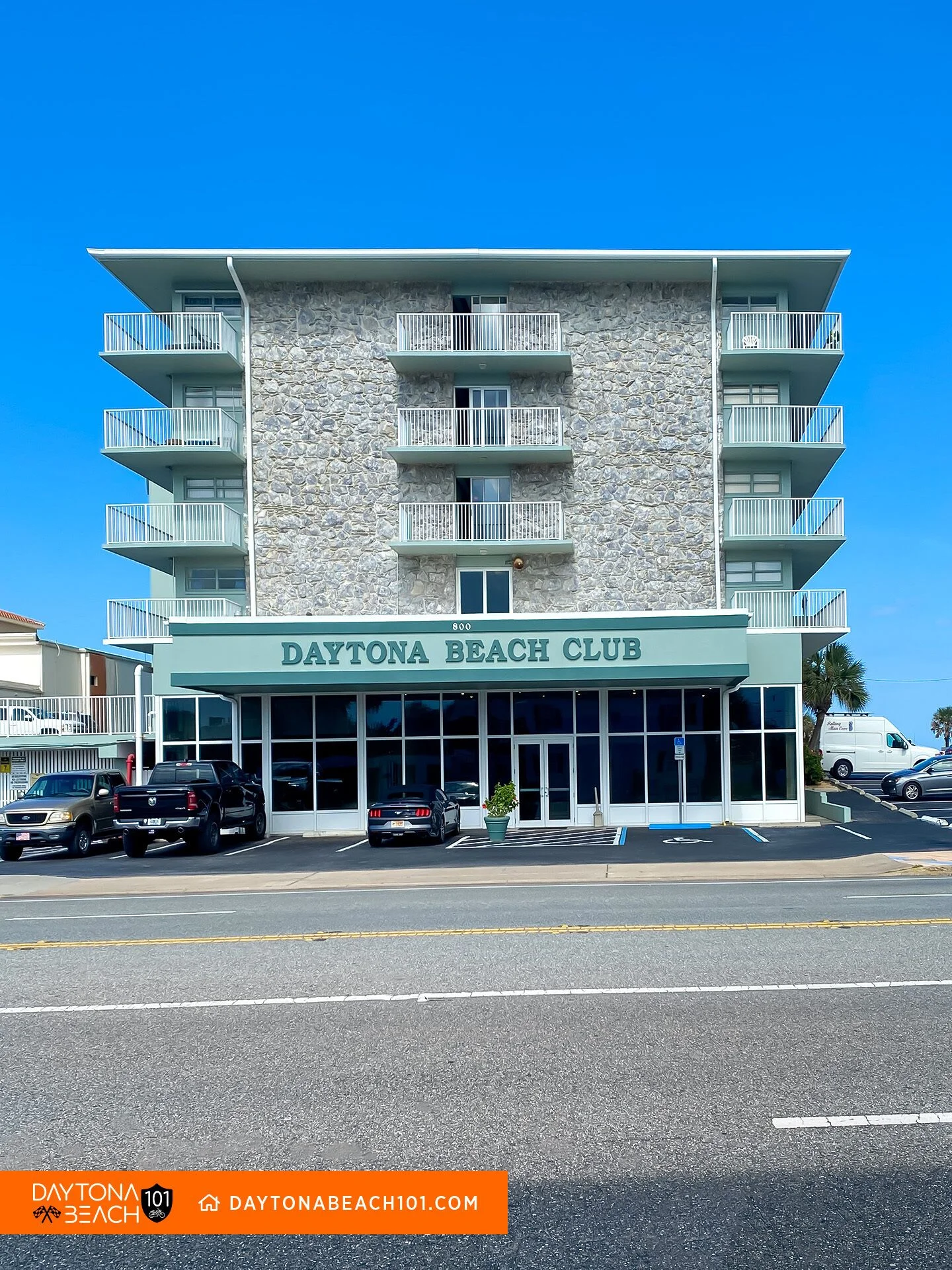 Oceanfront building managed by a team answering how much do STR management companies charge for owners
