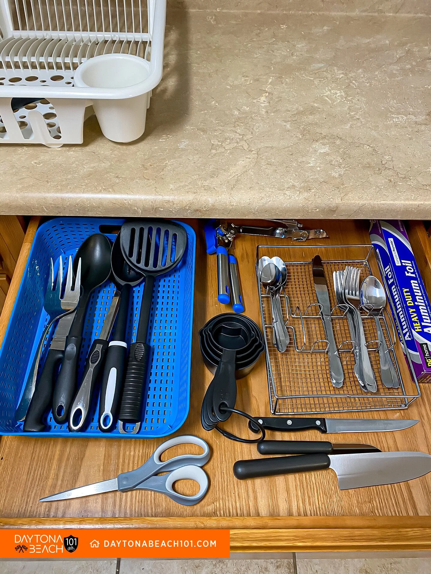 Organized kitchen drawer with utensils and cooking tools in dividers in Davenport, FL vacation rental