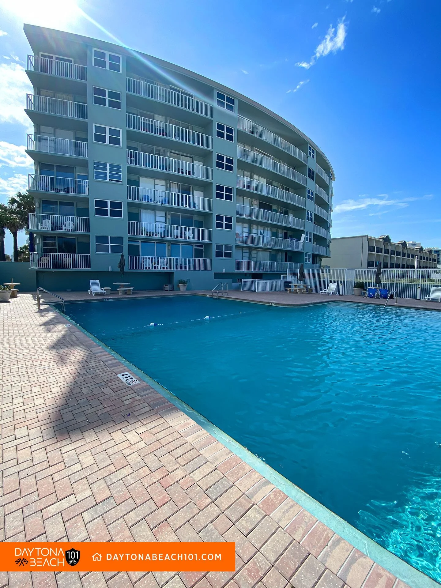 Beachfront resort pool with oceanfront building and private balconies in Daytona Beach vacation rental